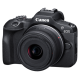 Canon EOS R100 mirrorless camera front view with RF-S 18-45mm lens attached, compact black body design